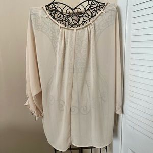 Sheer blouse with chain embellishment